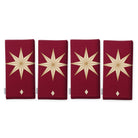 Stars Christmas napkins in burgundy and gold, set of four, folded on white, showing the same large gold eight-pointed star