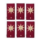 Stars Christmas napkins in burgundy and gold, set of six, folded on white, showing the same large gold eight-pointed star