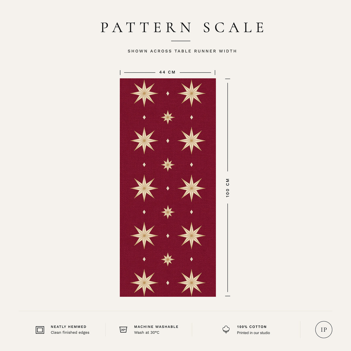 Pattern scale of the Stars Christmas table runner in burgundy and gold across its 44 cm width, with care notes