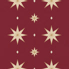 Close-up of the Stars Christmas table runner print in burgundy and gold on cotton, showing large gold eight-pointed stars