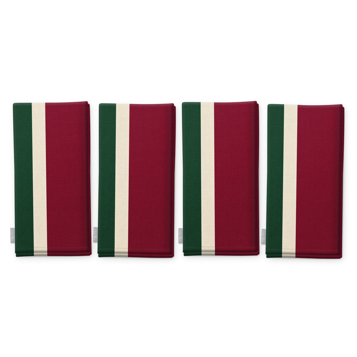Signature Stripe Christmas napkins in burgundy, green and ivory, set of four, folded on white, showing the same broad stripes