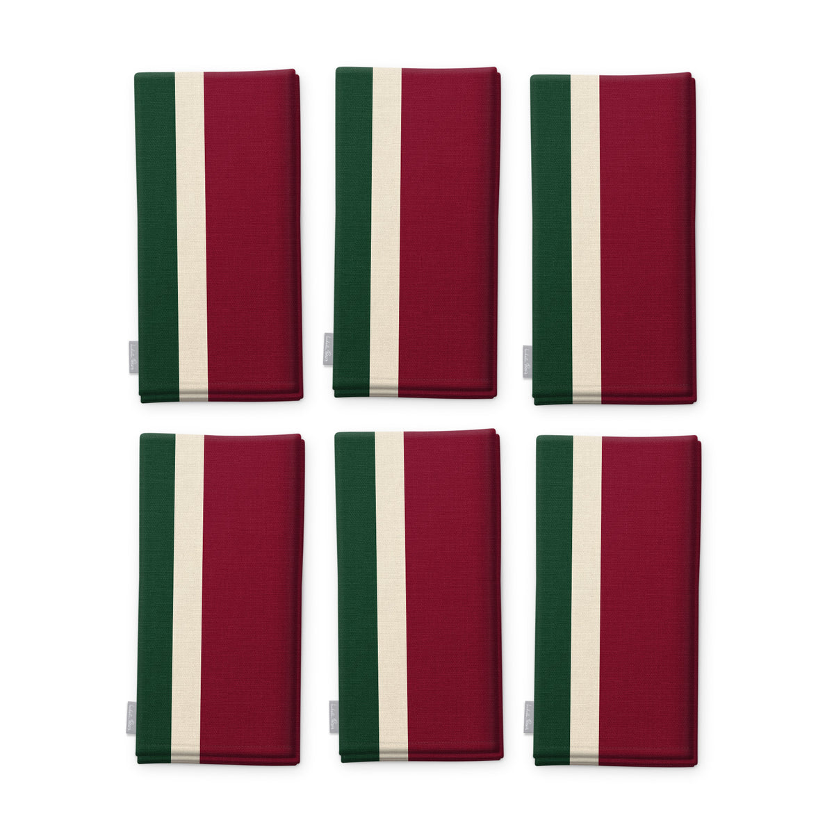 Signature Stripe Christmas napkins in burgundy, green and ivory, set of six, folded on white, showing the same broad stripes