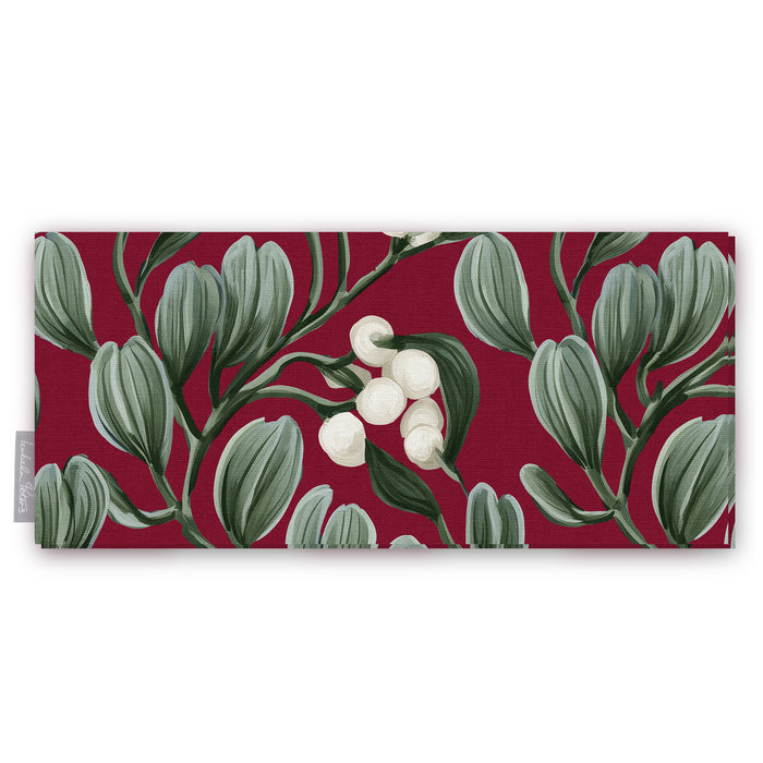 Burgundy Mistletoe Christmas table runner folded on white, showing sprigs of mistletoe with white berries