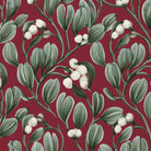 Close-up of the burgundy Mistletoe Christmas tablecloth print on cotton, showing sprigs of mistletoe with white berries