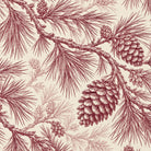 Close-up of the Pine Bough Christmas napkin print in burgundy on ivory cotton, showing pine boughs and cones