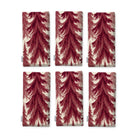 Spruce Stand Christmas napkins in burgundy on ivory, set of six, folded on white, showing the same spruce trees