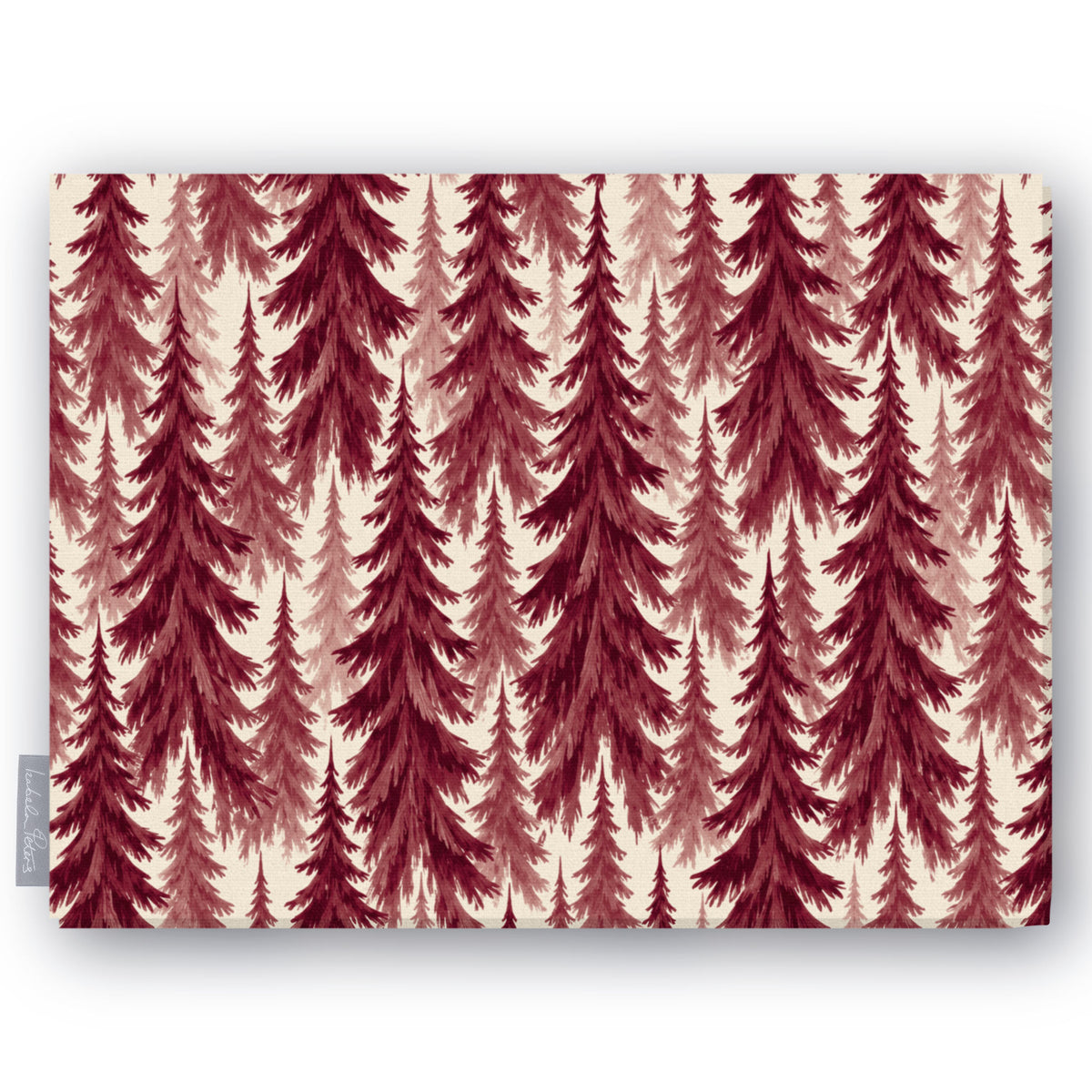 Spruce Stand Christmas tablecloth in burgundy on ivory, folded on white, showing rows of spruce trees