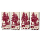 Village Toile napkins in burgundy on ivory, set of four, folded on white, showing the same fir tree and snowy cottage