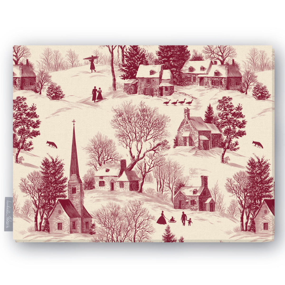 Village Toile Christmas tablecloth in burgundy on ivory, folded on white, showing a snowy village with a church and cottages