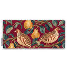 Burgundy Partridge and Pear Christmas table runner folded on white, showing a partridge among pears and leaves