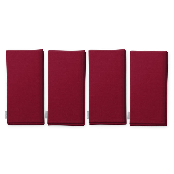 Plain burgundy cotton Christmas napkins, set of four, folded on white