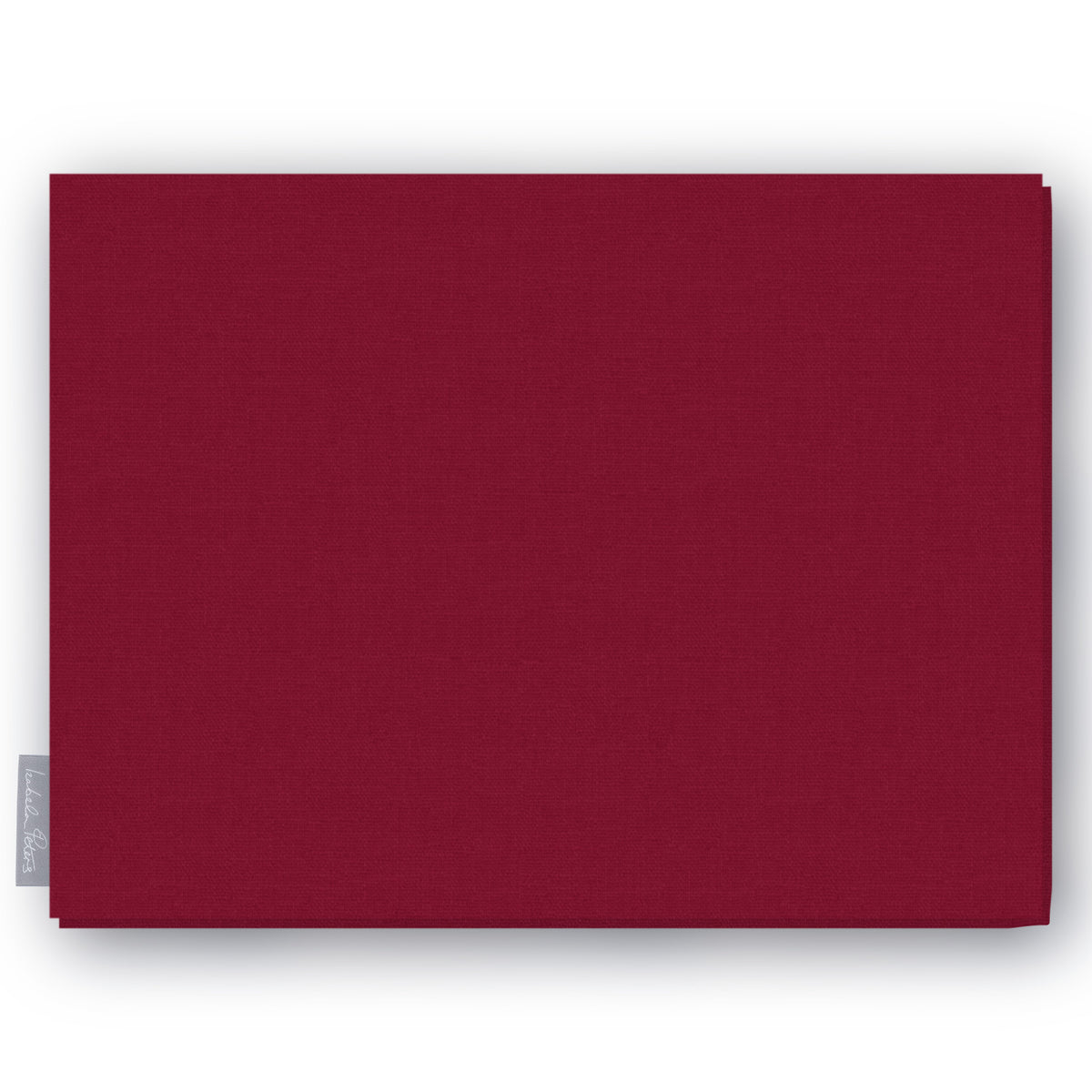 Plain burgundy cotton Christmas tablecloth folded on white