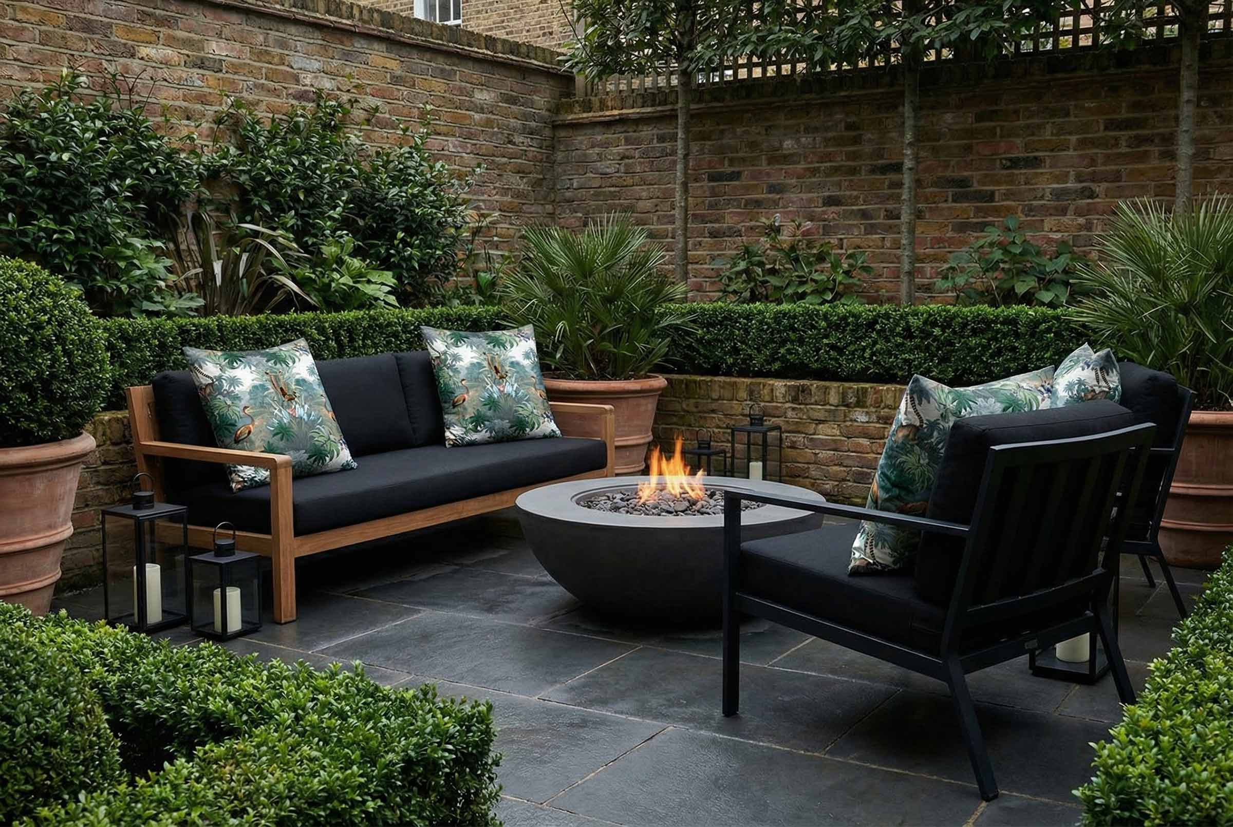 Flora and Fauna outdoor garden cushions styled on modern patio seating in a UK garden setting