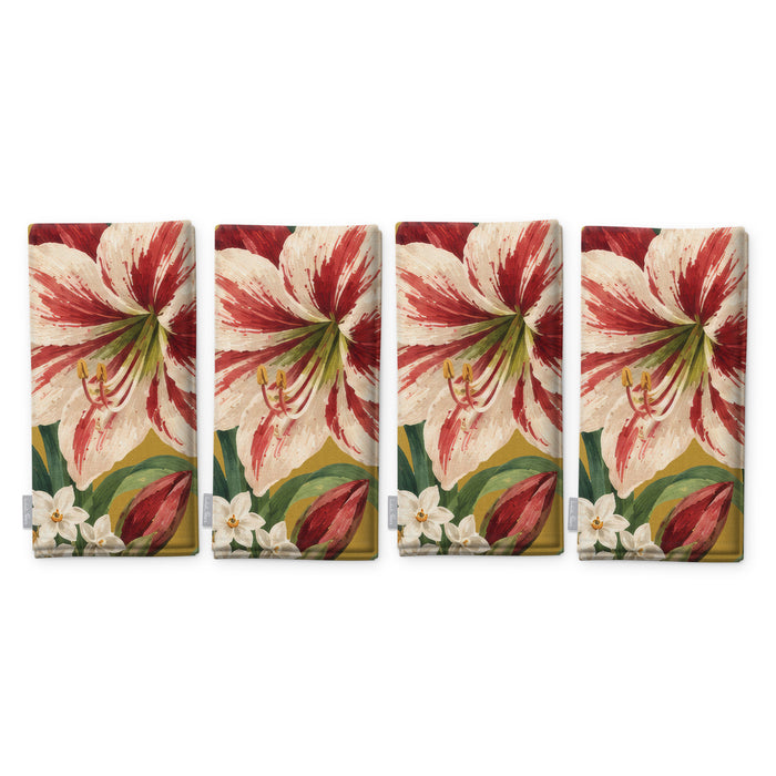 Gold Amaryllis Christmas napkins, set of four, folded on white, showing the same amaryllis flower