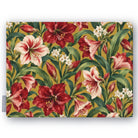 Gold Amaryllis Christmas tablecloth folded on white, showing amaryllis flowers among long leaves