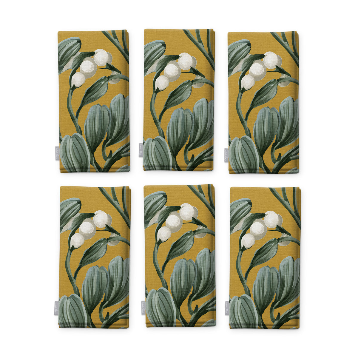 Gold Mistletoe Christmas napkins, set of six, folded on white, showing the same sprig of mistletoe with white berries