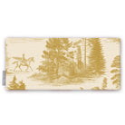 Fir Forest Toile Christmas table runner in gold on ivory, folded on white, showing a rider on horseback among fir trees