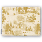 Village Toile Christmas tablecloth in gold on ivory, folded on white, showing a snowy village with a church and cottages