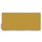 Plain gold cotton Christmas table runner folded on white