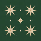 Close-up of the Stars Christmas napkin print in green and gold on cotton, showing gold eight-pointed stars