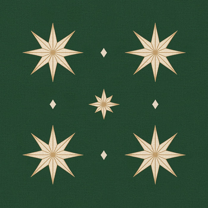Close-up of the Stars Christmas napkin print in green and gold on cotton, showing gold eight-pointed stars