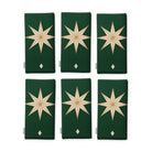 Stars Christmas napkins in green and gold, set of six, folded on white, showing the same large gold eight-pointed star