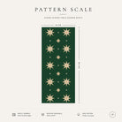 Pattern scale of the Stars Christmas table runner in green and gold across its 44 cm width, with care notes