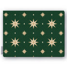 Stars Christmas tablecloth in green and gold, folded on white, showing gold eight-pointed stars