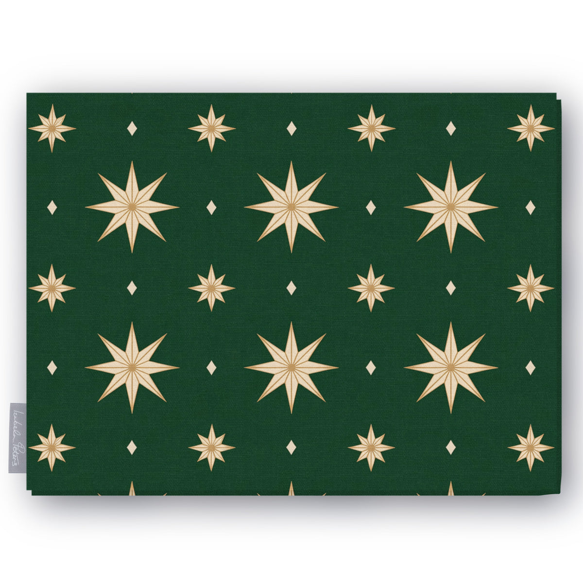 Stars Christmas tablecloth in green and gold, folded on white, showing gold eight-pointed stars