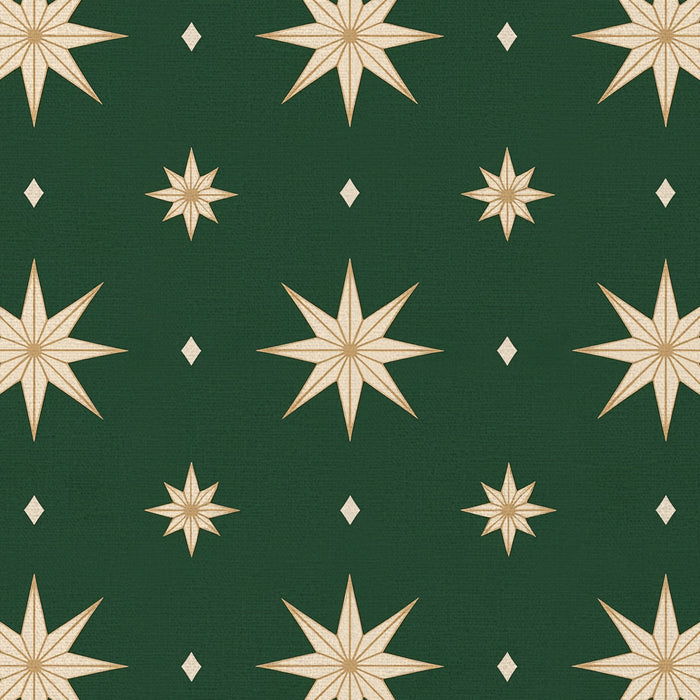 Close-up of the Stars Christmas tablecloth print in green and gold on cotton, showing gold eight-pointed stars