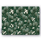 Green Mistletoe Christmas tablecloth folded on white, showing sprigs of mistletoe with white berries