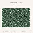 Pattern scale of the Mistletoe Christmas tablecloth in green across its 144 cm width, with care notes