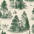 Close-up of the Fir Forest Toile Christmas table runner print in green on ivory cotton, showing fir trees and a rider
