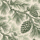 Close-up of the Pine Bough Christmas napkin print in green on ivory cotton, showing pine boughs and cones