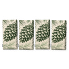Pine Bough Christmas napkins in green on ivory, set of four, folded on white, showing the same pine cone on a bough