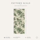 Pattern scale of the Pine Bough Christmas table runner in green on ivory across its 44 cm width, with care notes