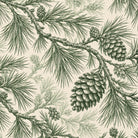 Close-up of the Pine Bough Christmas tablecloth print in green on ivory cotton, showing pine boughs and cones