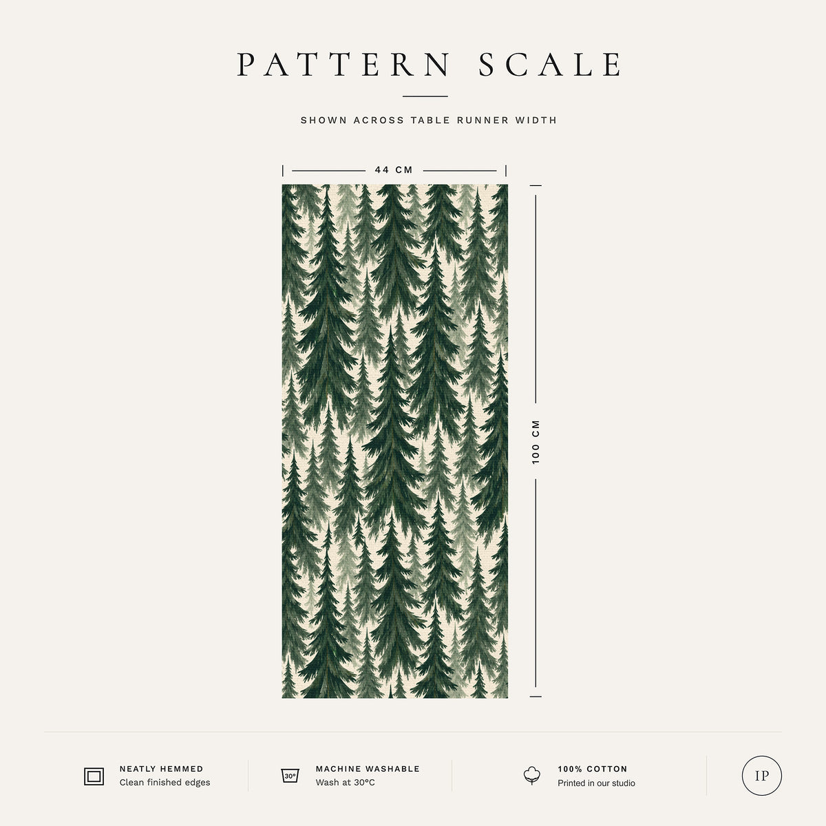 Pattern scale of the Spruce Stand Christmas table runner in green on ivory across its 44 cm width, with care notes