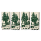 Village Toile Christmas napkins in green on ivory, set of four, folded on white, showing the same fir tree and snowy cottage