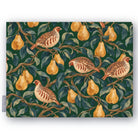Green Partridge and Pear Christmas tablecloth folded on white, showing partridges among pears and leaves