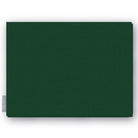 Plain green cotton Christmas tablecloth folded on white
