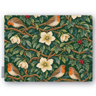 Green Robins and Christmas Roses Christmas tablecloth folded on white, showing robins, Christmas roses and holly