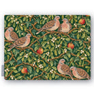 Green Turtle Doves and Mistletoe Christmas tablecloth folded on white, showing turtle doves among mistletoe and red apples