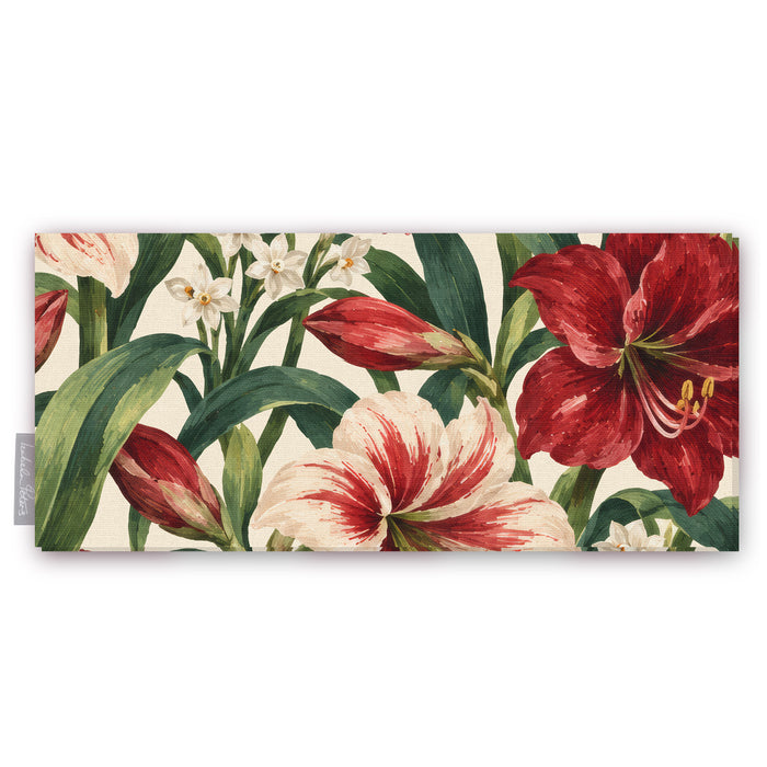 Ivory Amaryllis Christmas table runner folded on white, showing amaryllis flowers among long leaves