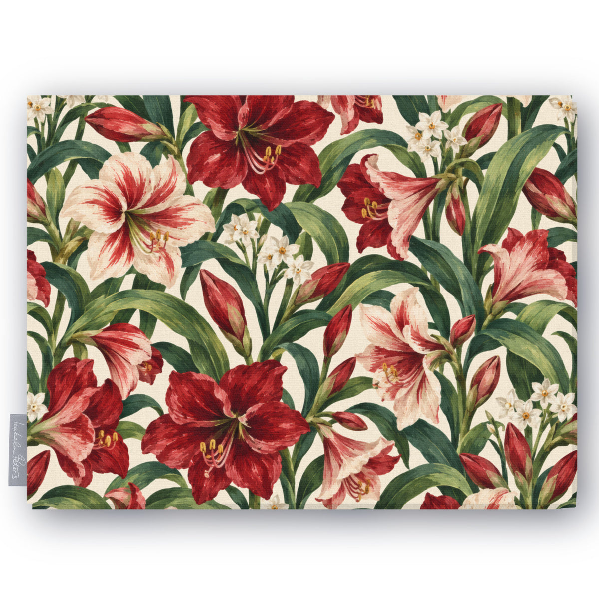 Ivory Amaryllis Christmas tablecloth folded on white, showing amaryllis flowers among long leaves