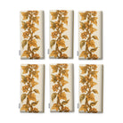 Gilded Ivy Christmas napkins in ivory and gold, set of six folded napkins showing the same trail of gold ivy and berries