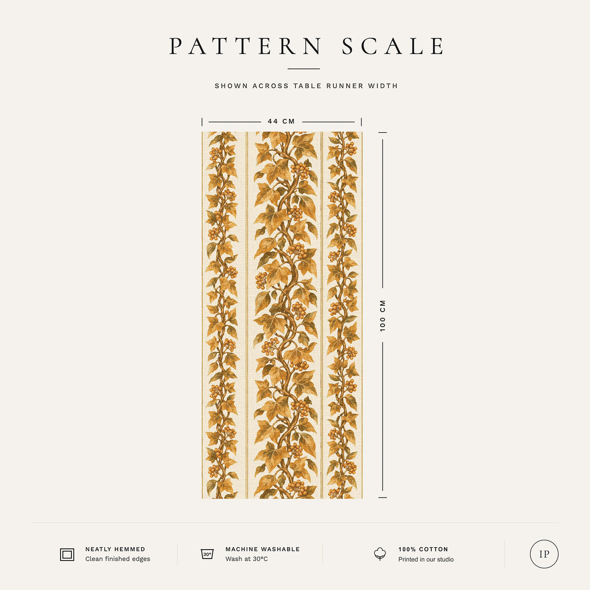 Pattern scale of the Gilded Ivy Christmas table runner in ivory and gold across its 44 cm width, with care notes