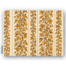 Gilded Ivy Christmas tablecloth in ivory and gold, folded on white, showing trails of gold ivy and berries