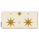 Stars Christmas table runner in ivory and gold, folded on white, showing large gold eight-pointed stars