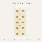 Pattern scale of the Stars Christmas table runner in ivory and gold across its 44 cm width, with care notes